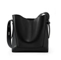 Black leather handbag on a white background